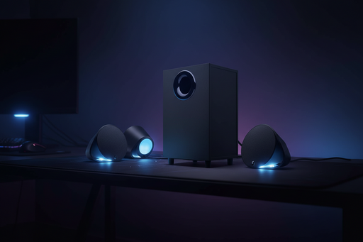 Black subwoofer with blue lights on a white background